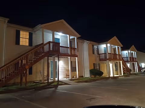 Night exterior of a Holly Tree Semi Independent Residential building with external staircases.