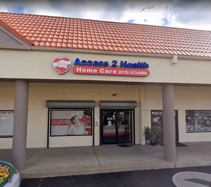 Front view of Access 2 Health Home Care storefront with red-tiled roof.
