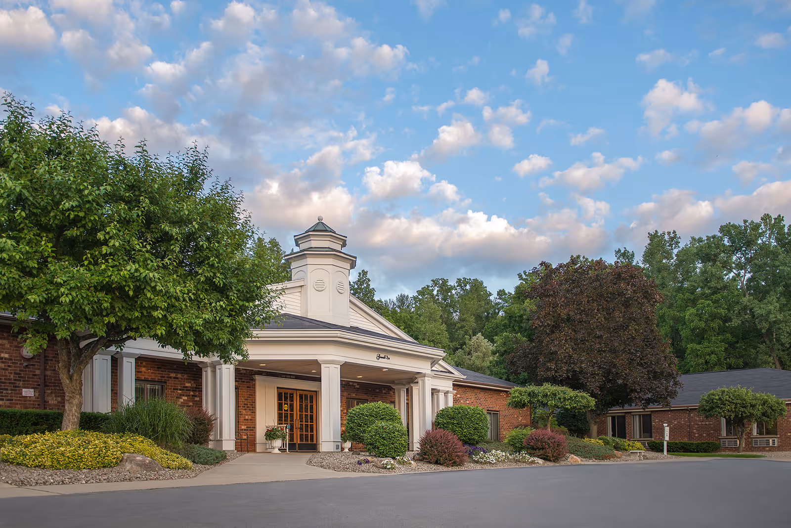Exterior view of Legacy at Grande Vie senior living facility entrance
