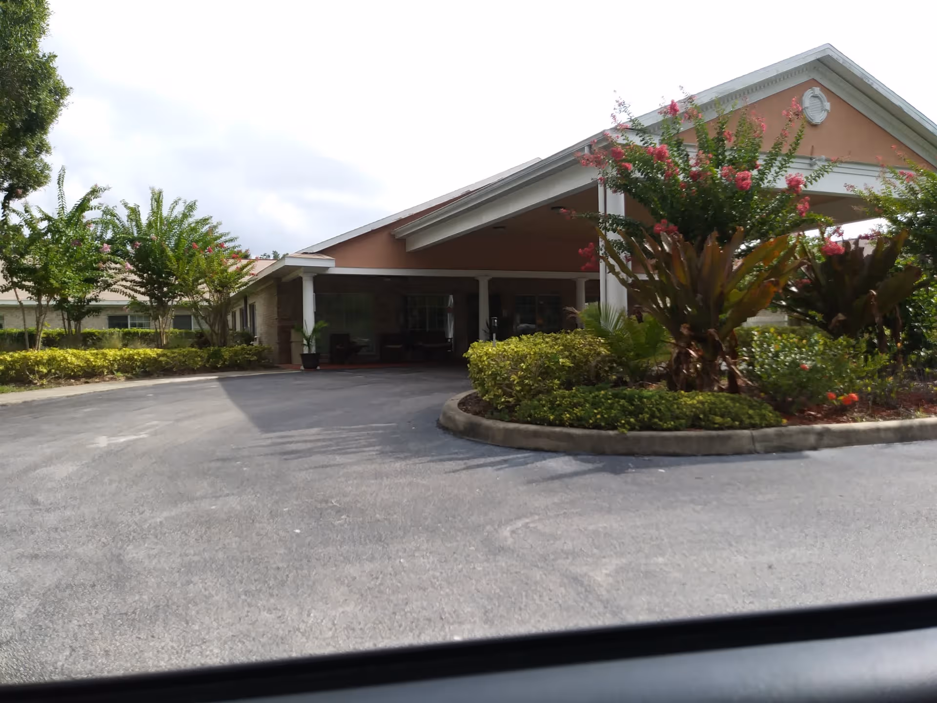 Gulf Shore Care Center exterior with driveway and landscaped entrance