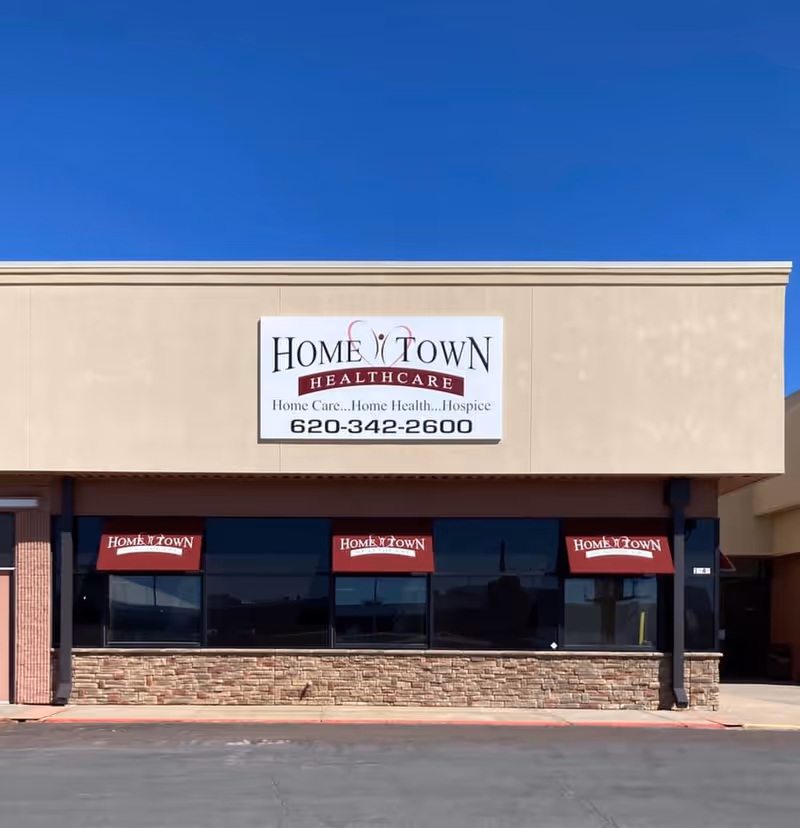 Front exterior of Home Town Healthcare with large sign and storefront windows.