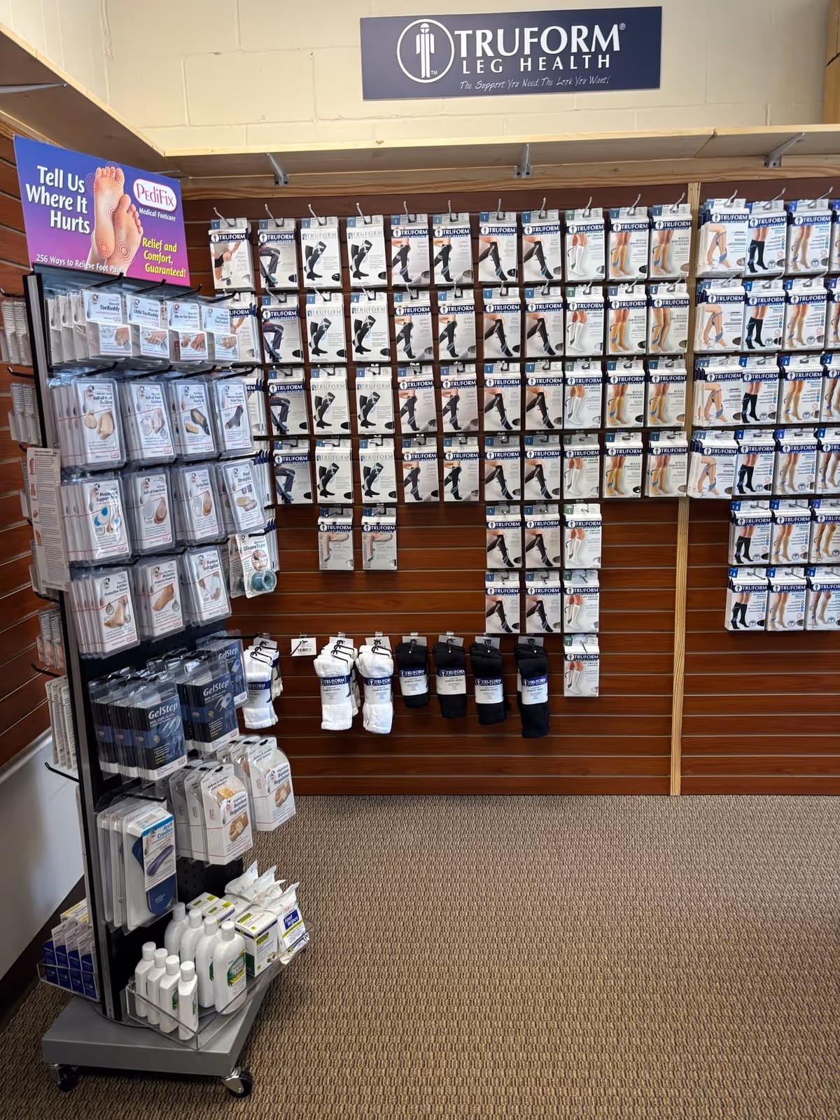Interior retail display of leg supports and medical accessories in a senior care facility.