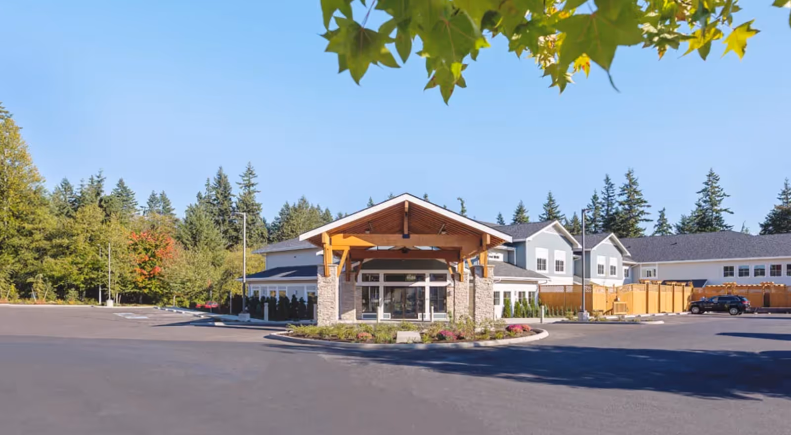 Exterior view of Mukilteo Memory Care with a covered entrance.
