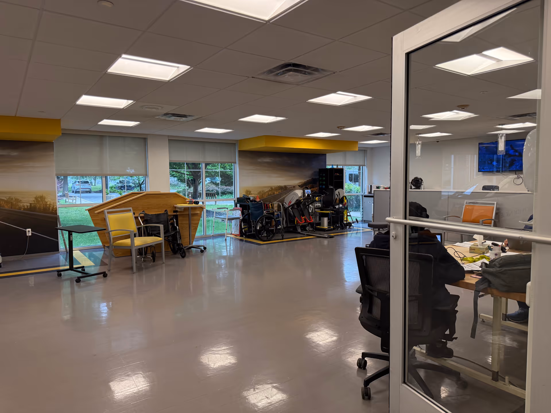 Interior of Providence at Mercy Fitzgerald facility with rehab equipment and a desk area.