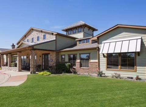 Walnut Creek Assisted Living front exterior with lawn and covered entrance.