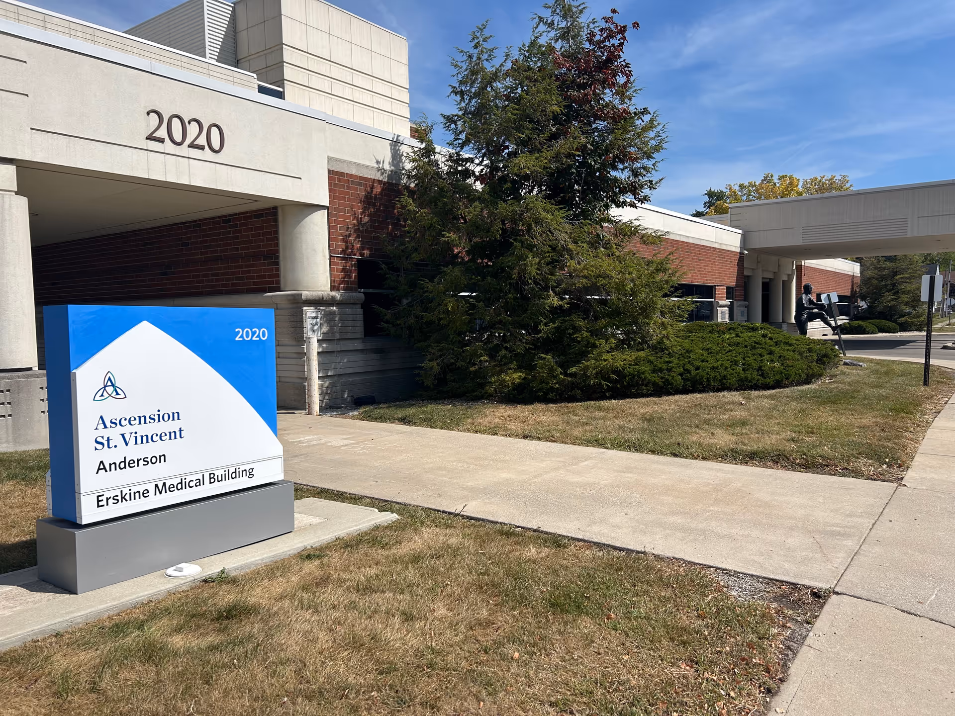 Exterior view of a medical building with a blue Ascension St. Vincent sign.