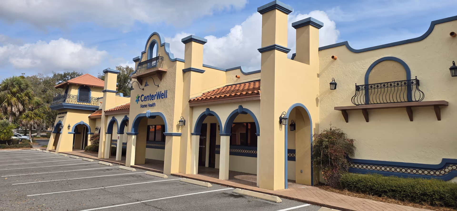 Exterior view of CenterWell Home Health The Villages building with arches
