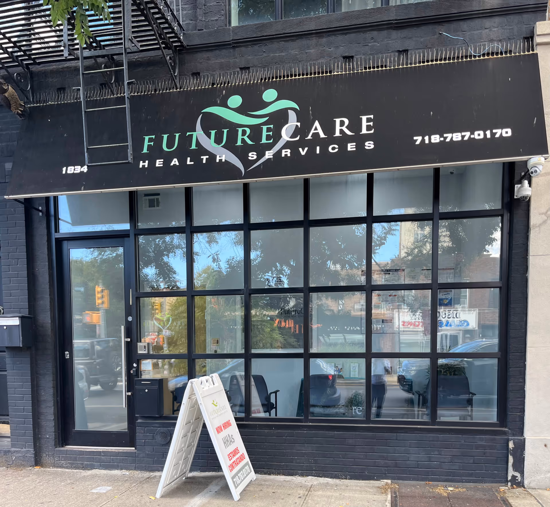 Black storefront sign reading Future Care Health Services above glass storefront windows