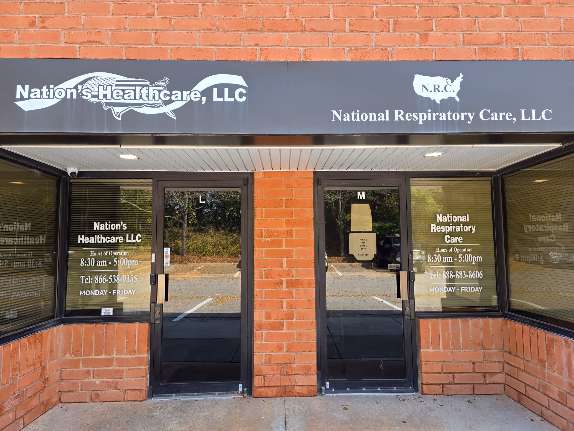 Brick storefront with glass doors and prominent medical signage above entrance