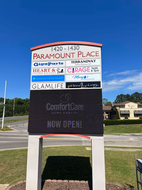 Outdoor signboard at Paramount Place listing businesses, including Aveanna Home Health.