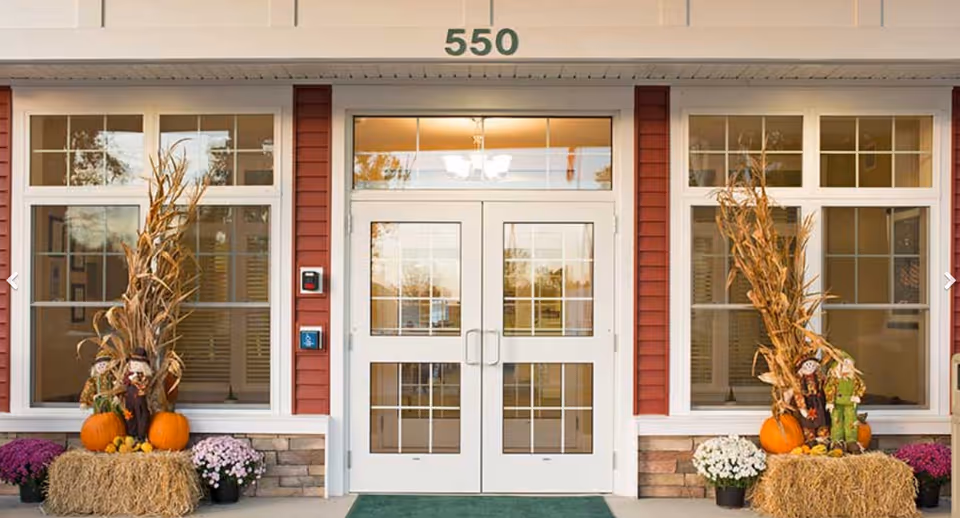Stonebrook Village Windsor Locks building front with autumn decorations.