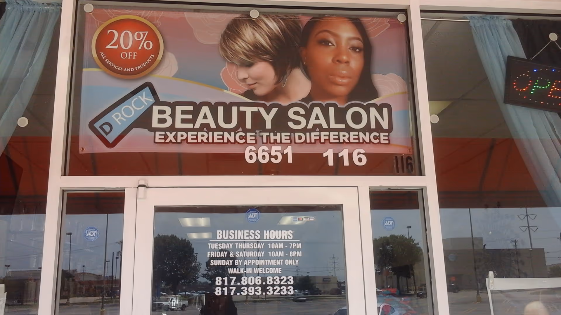 Front view of a beauty salon storefront with a large D ROCK Beauty sign.