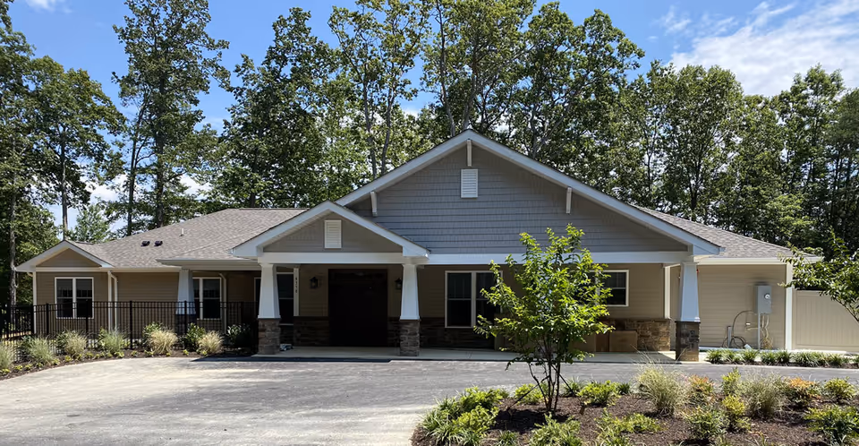 Front view of Evermore Senior Living, a single-story facility with covered entrance and landscaped surroundings.