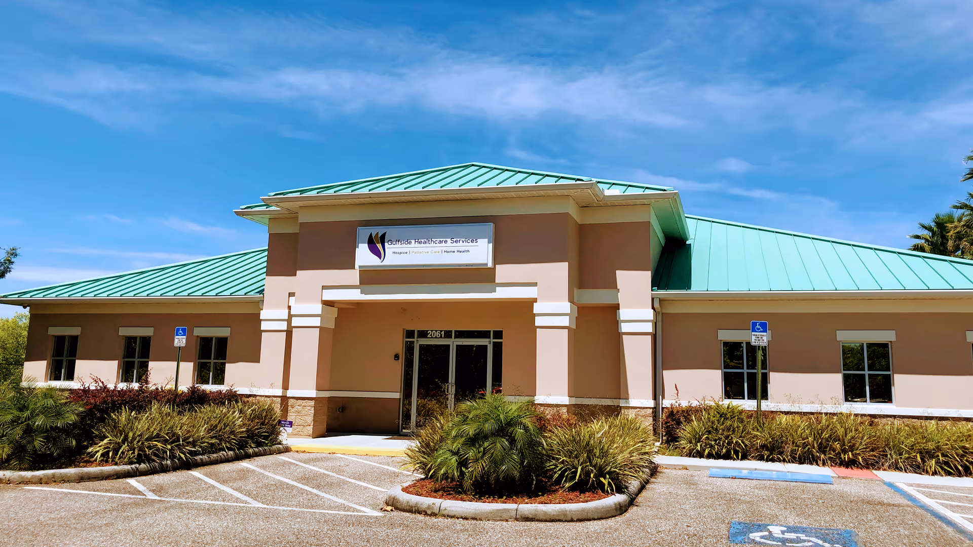Exterior view of Gulfside Healthcare Services CRC building with teal roof and accessible parking.