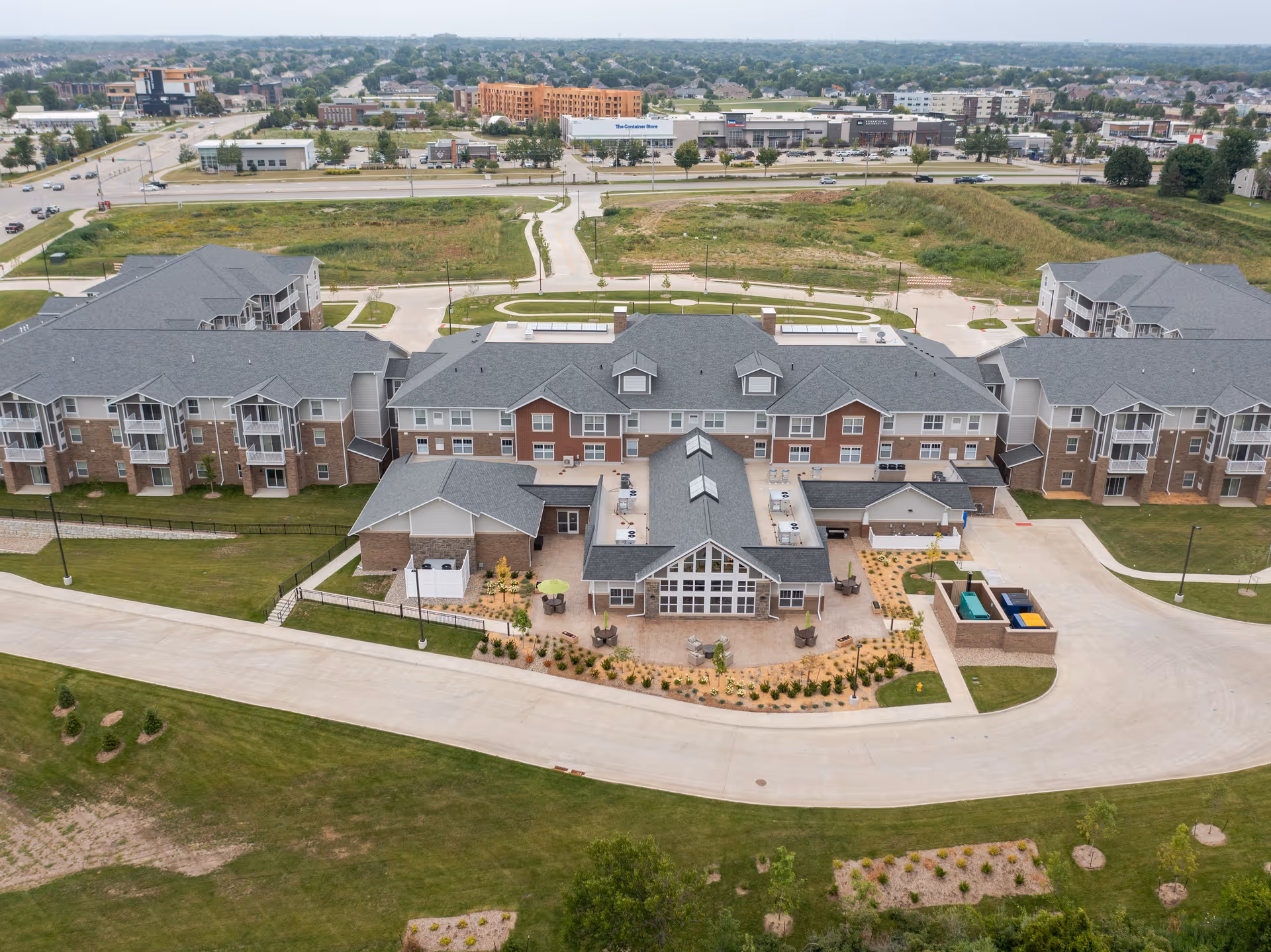 Aerial view of Glen Meadows senior living campus with multiple buildings and landscaped grounds.