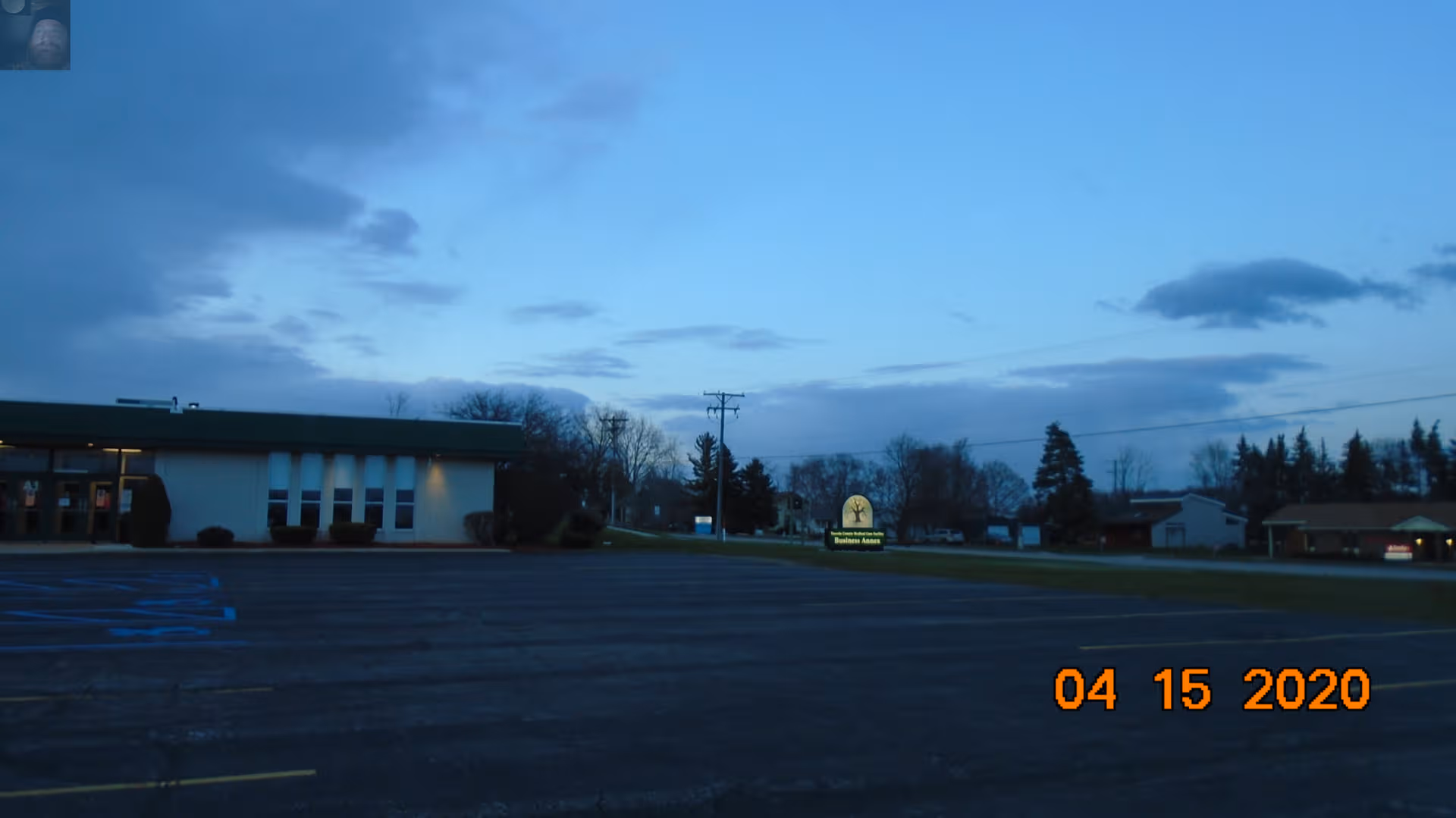 Exterior view of Tuscola County Medical Care Community with parking lot and sign.