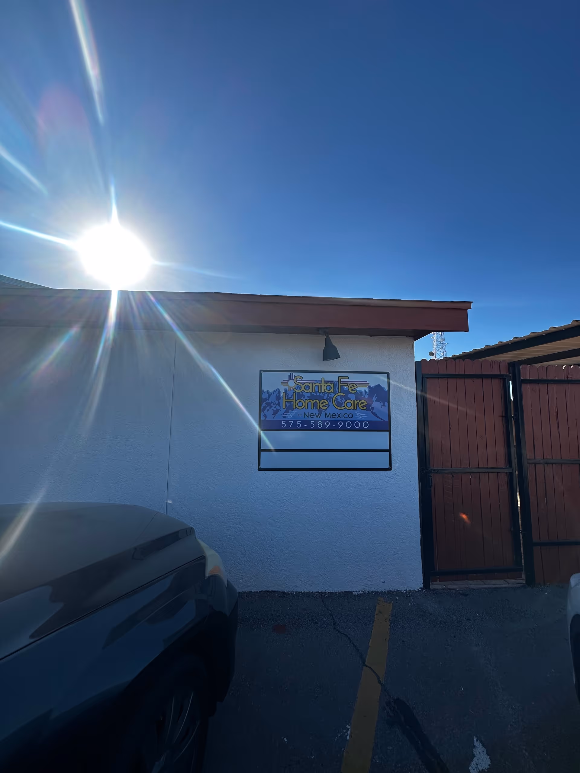 Front exterior view of Santa Fe Home Care of New Mexico building with its sign.
