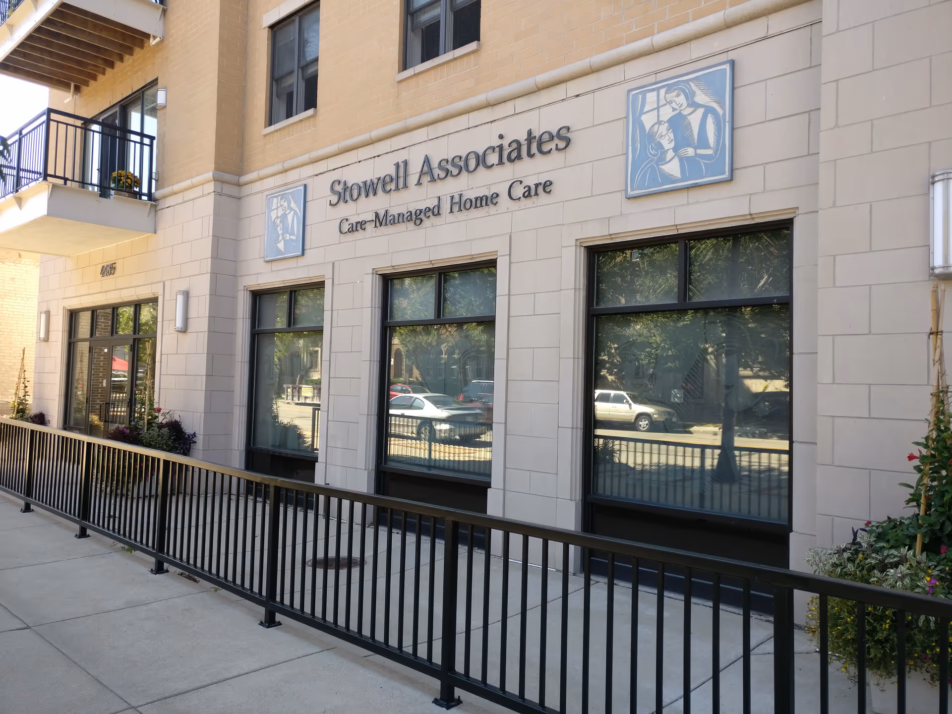 Exterior view of a care facility with Stowell Associates signage and large windows.