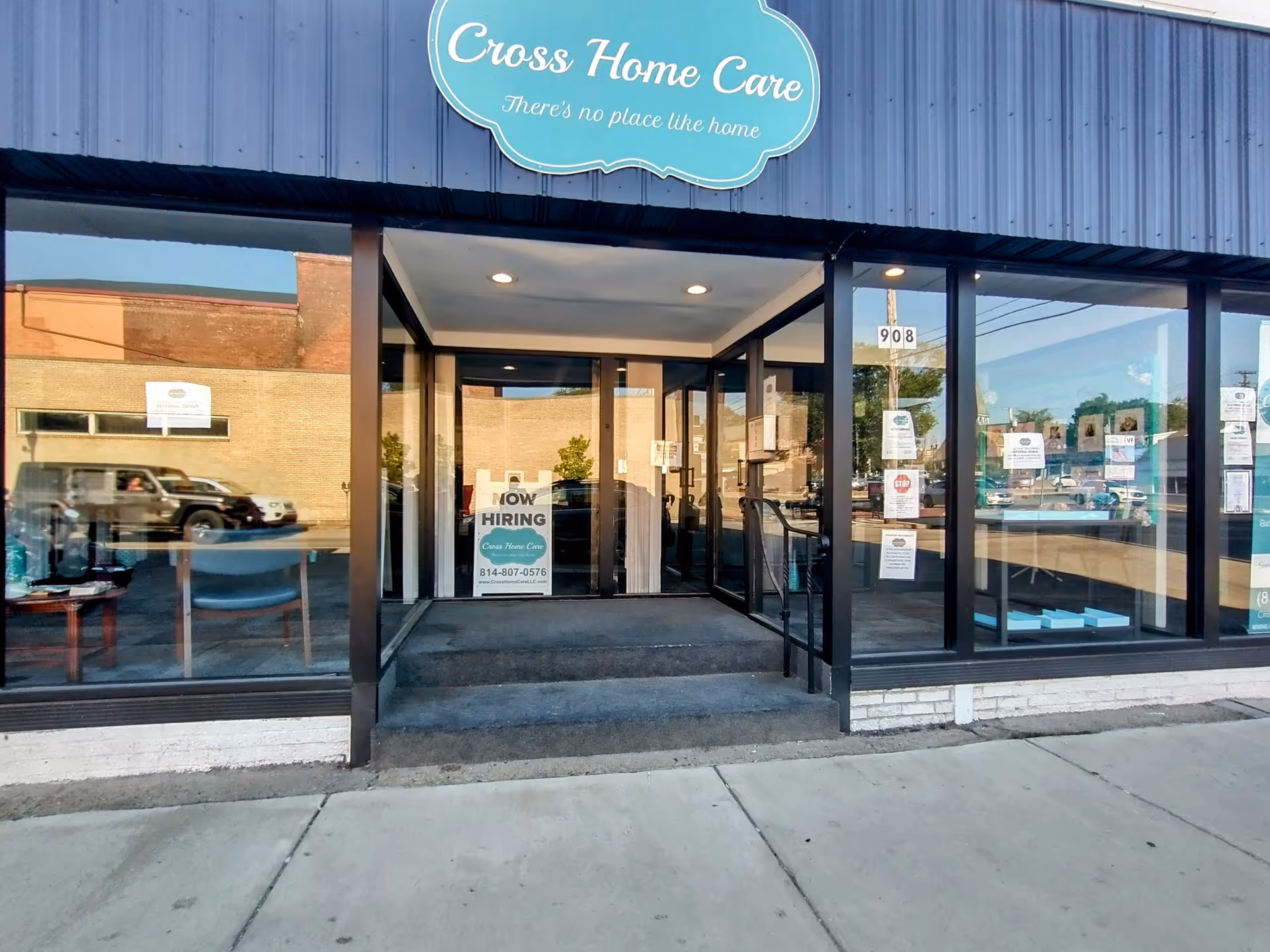 Cross Home Care storefront with glass doors and a NOW HIRING sign