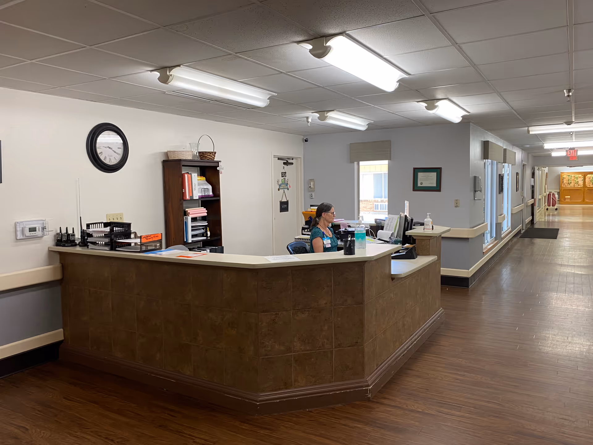 Reception desk in a hallway of a senior living facility.