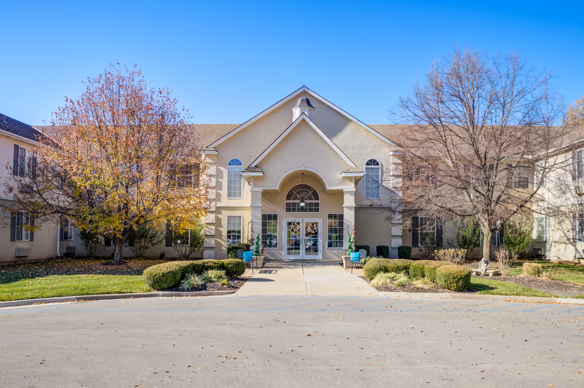 Exterior view of Bickford at Mission Springs II entrance with trees and landscaping.