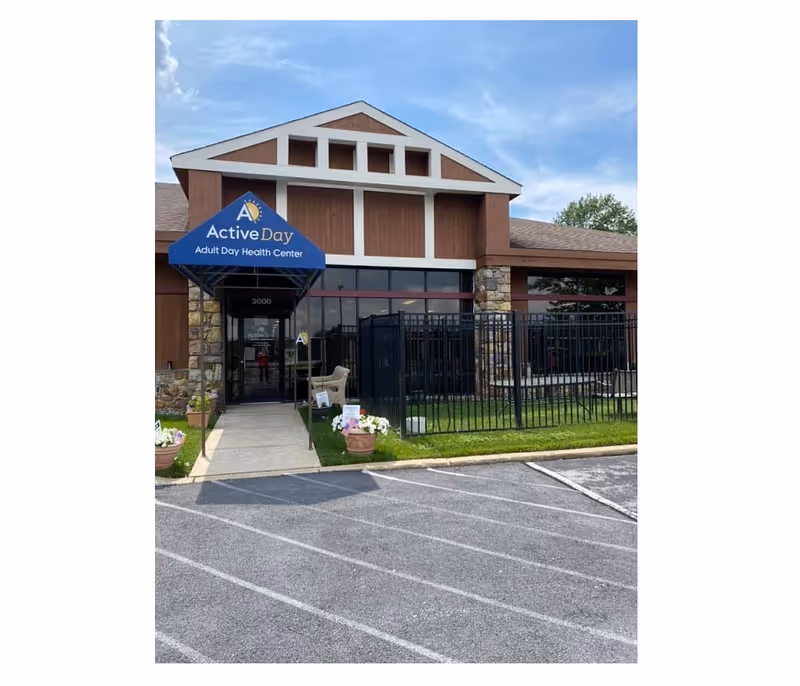 Front exterior of Active Day Adult Day Health Center with blue canopy entrance.