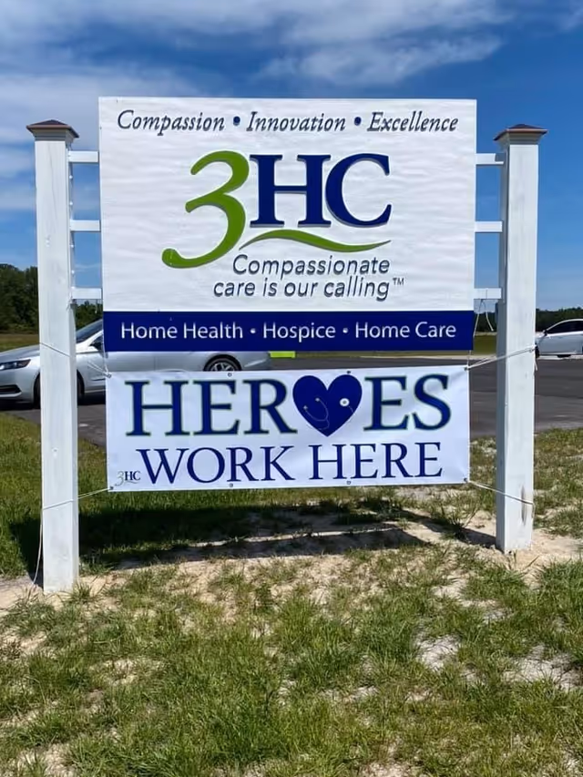 Outdoor sign display for 3HC Home Health and Hospice Care with Heroes Work Here banner.