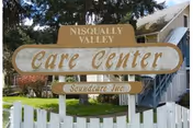 Outdoor front of a building with a Care Center sign and stairs