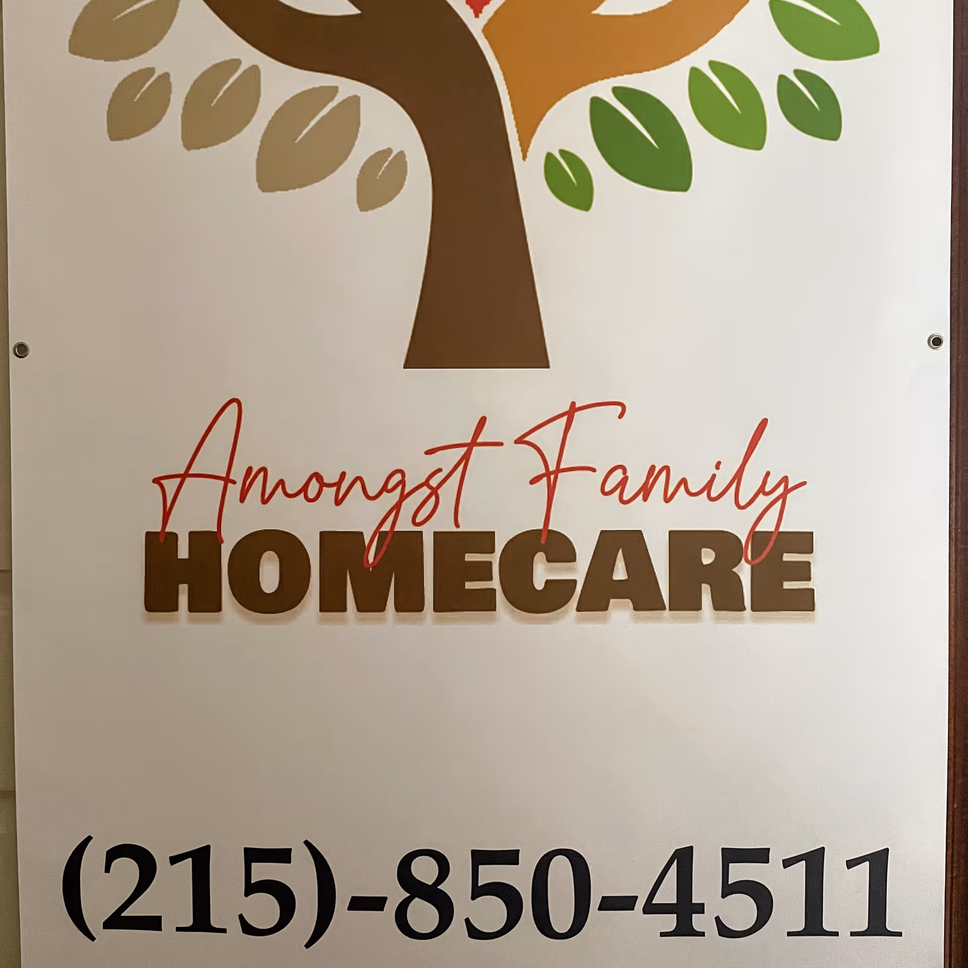 Signboard displaying Amongst Family Homecare logo and phone number.