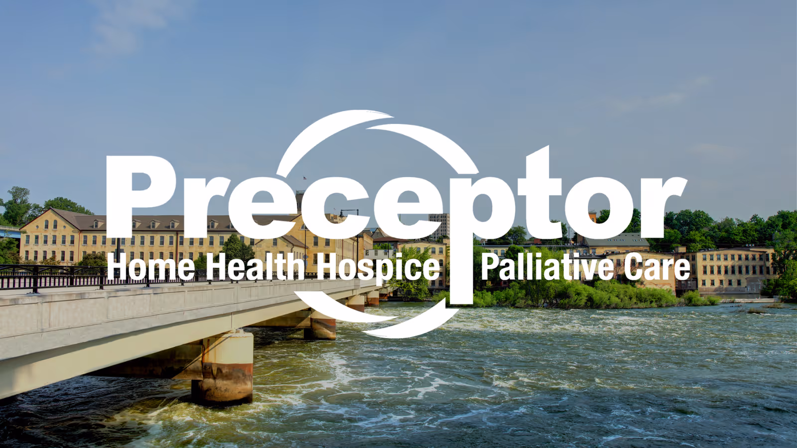Exterior view of a riverfront facility with a bridge and large Preceptor logo.