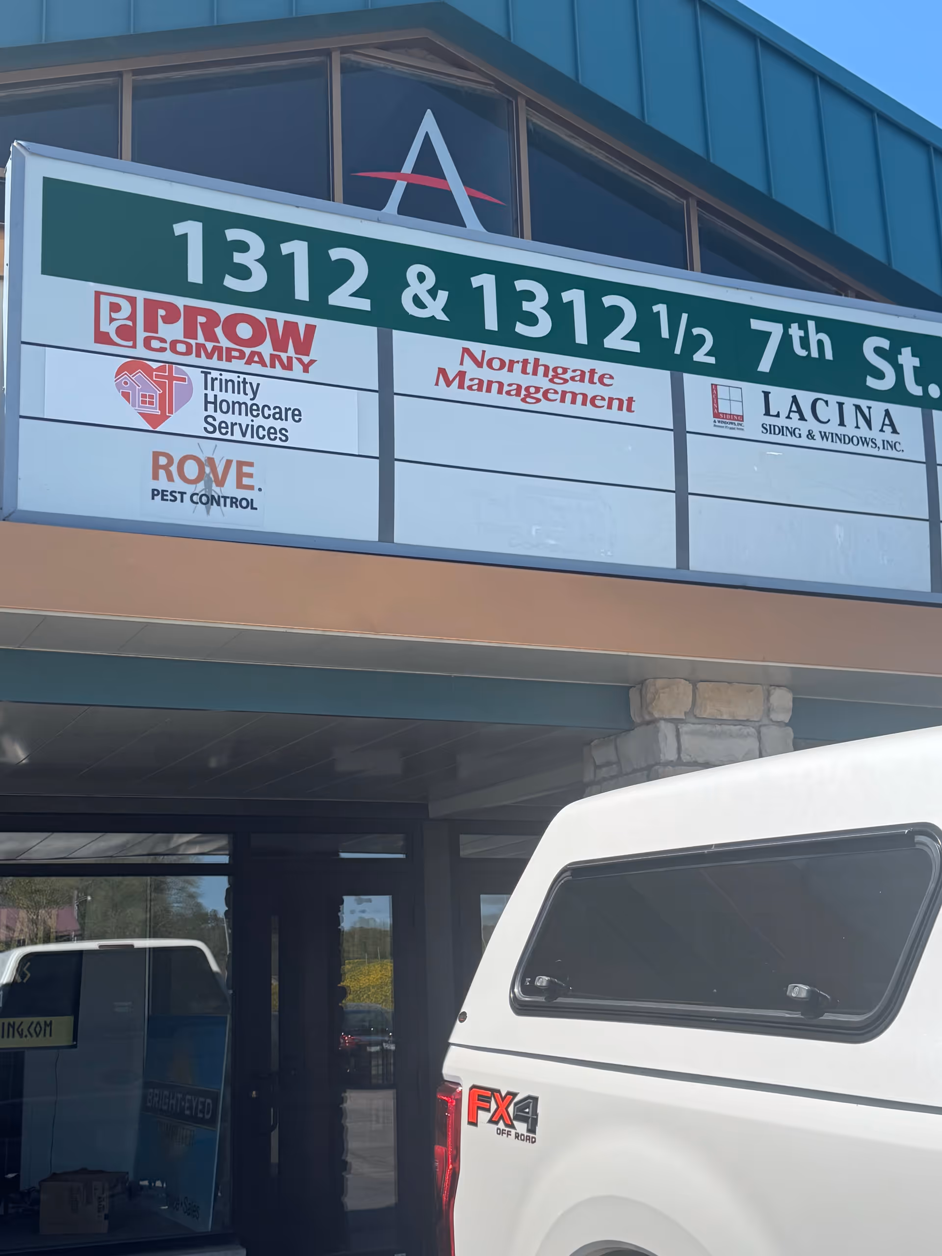 Exterior storefront with large signboard featuring Trinity Homecare Services logos