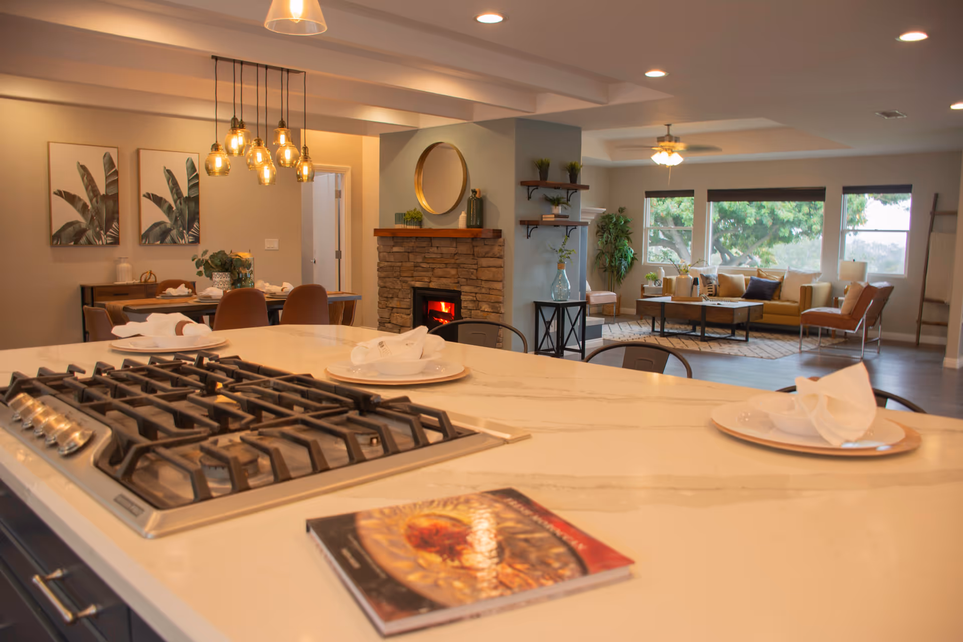 Open-concept interior of an assisted living facility with kitchen island and lounge