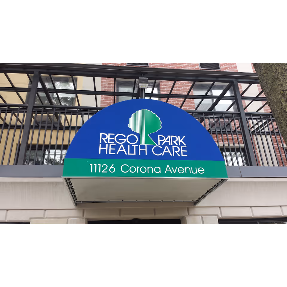 Entrance awning reading "Rego Park Health Care" with the address "11126 Corona Avenue" on the building facade.