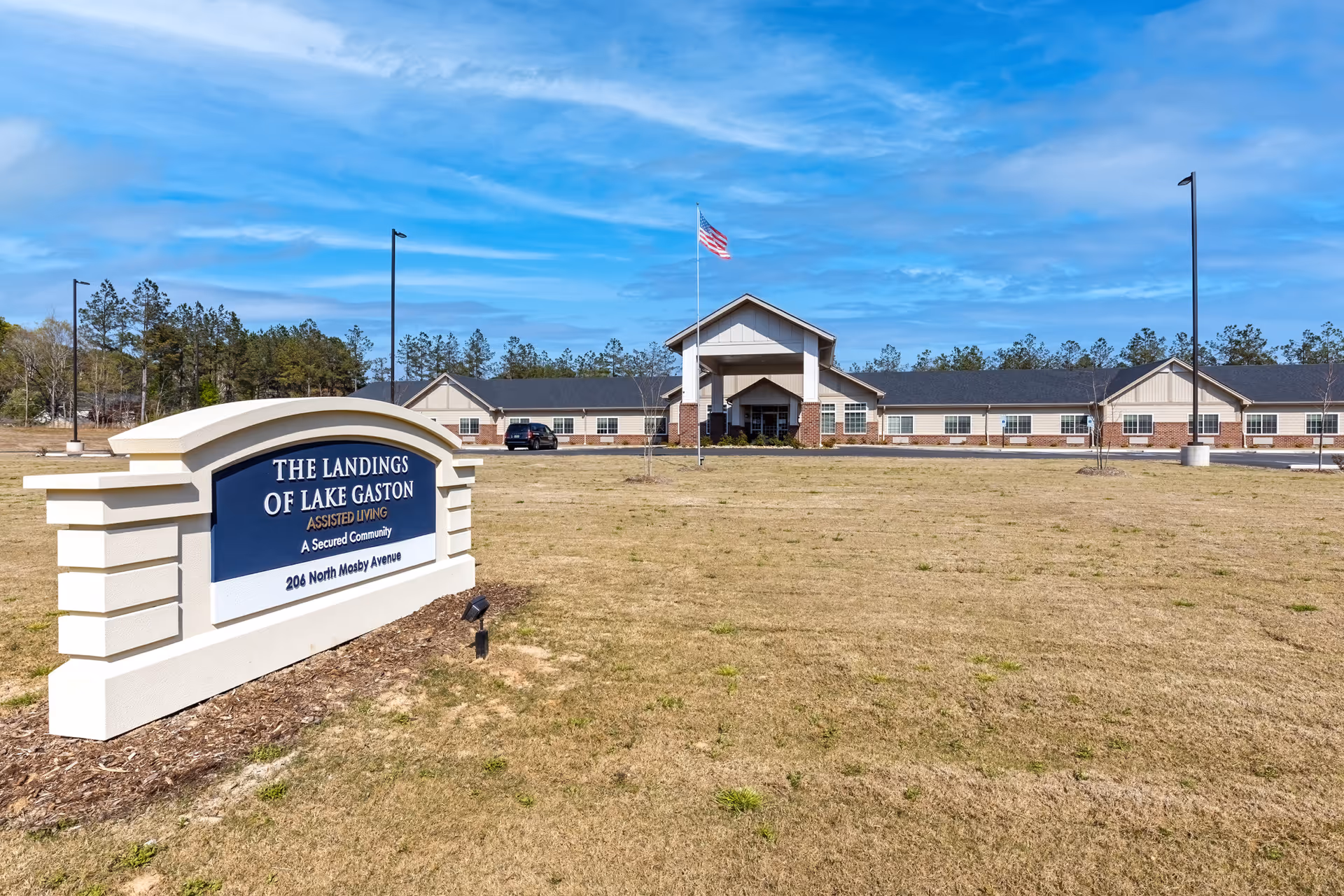 Exterior view of The Landings of Lake Gaston facility with sign and entrance.