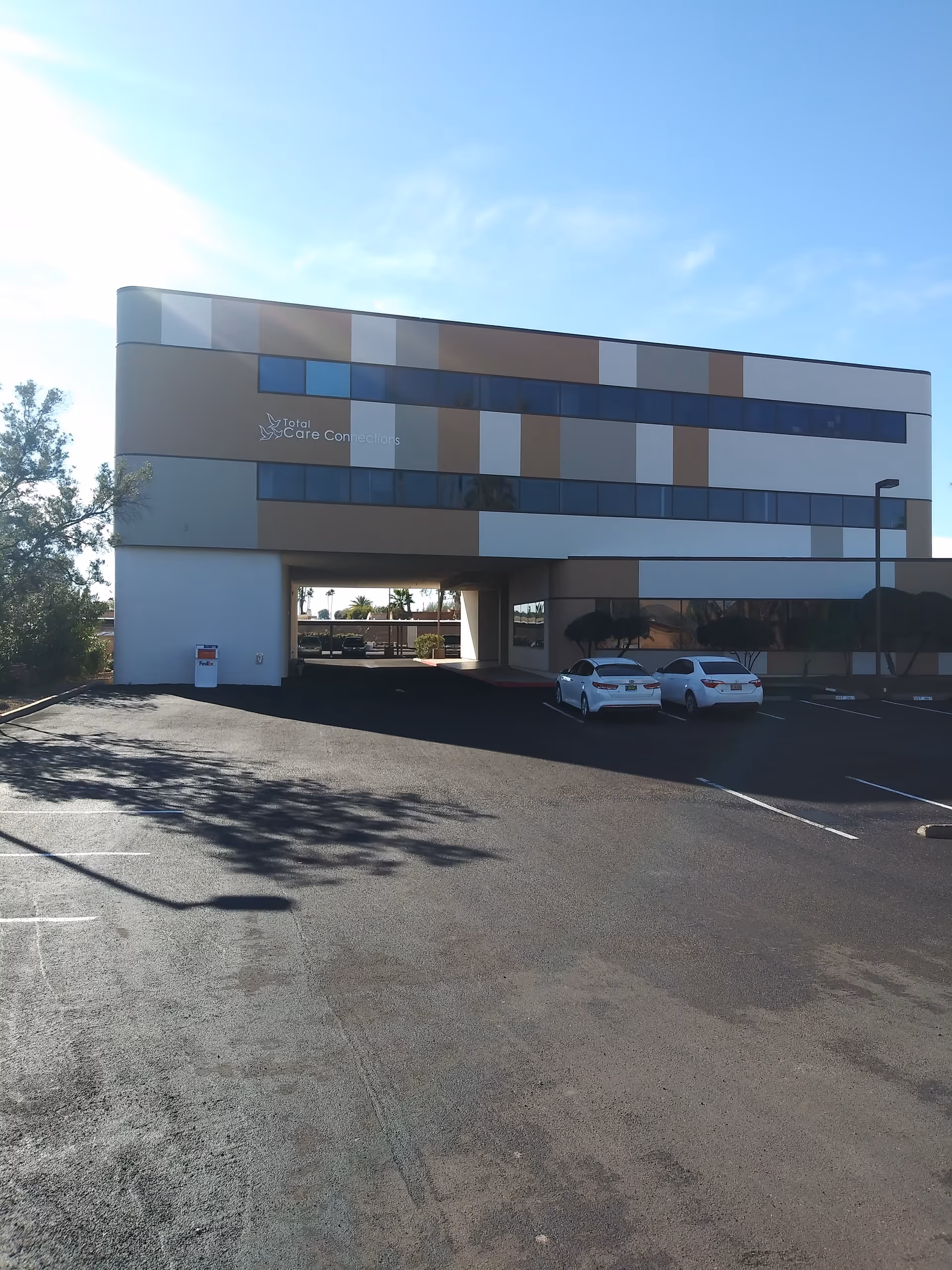 Front view of Total Care Connections building with parking lot.