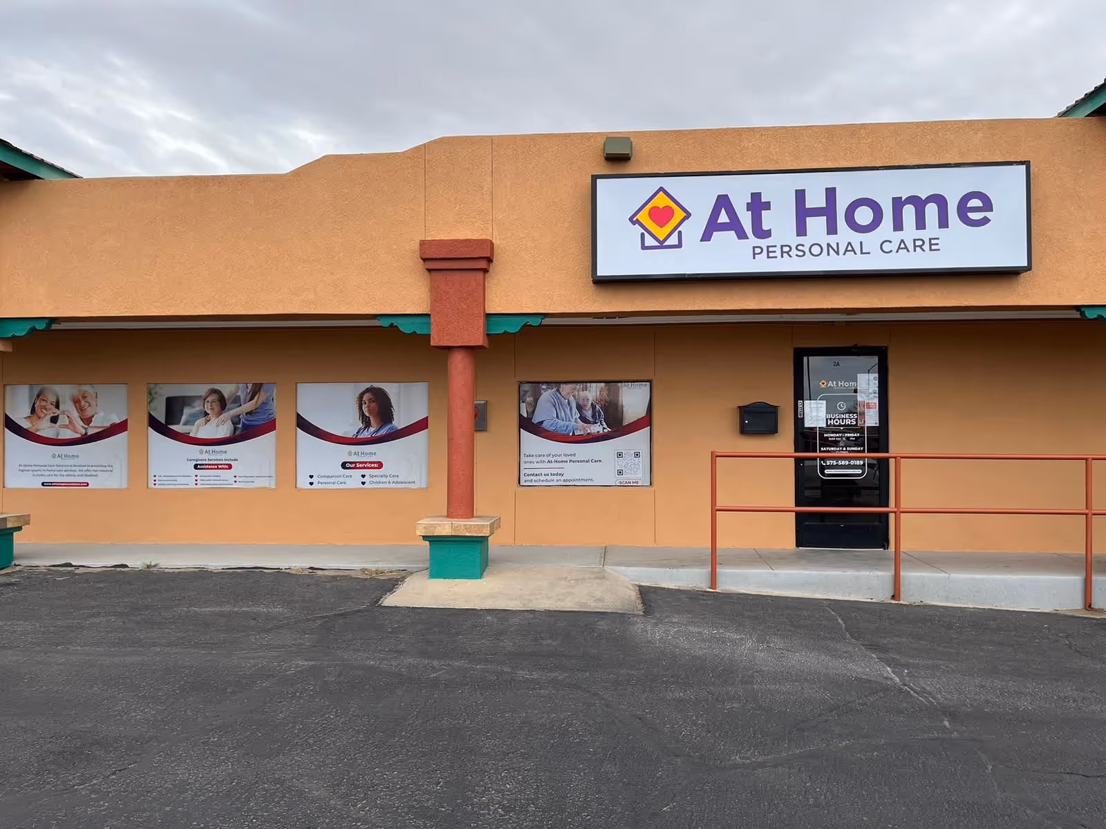 Exterior view of an orange building with an At Home Personal Care sign and entrance