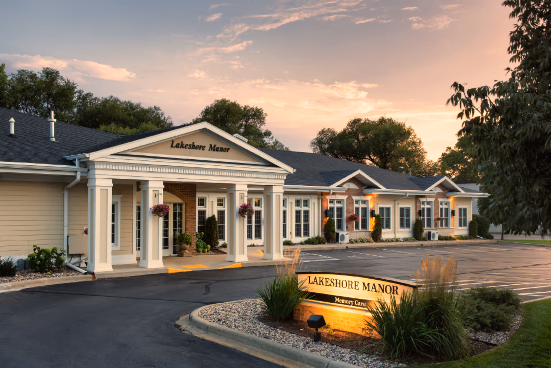 Exterior view of Lakeshore Manor building with a welcoming entrance and manicured landscaping.