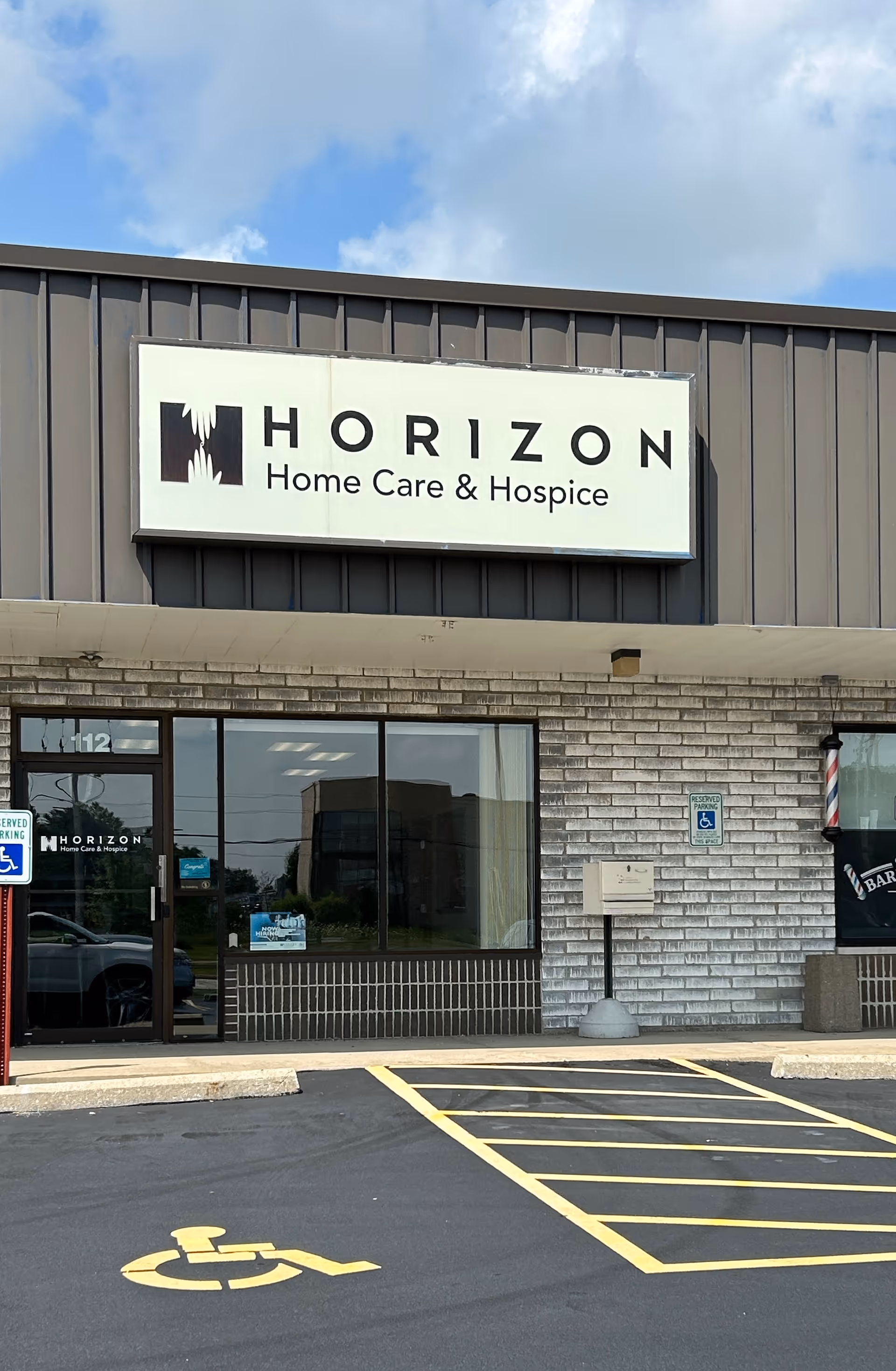 Front view of Horizon Home Care and Hospice Oak Creek Branch storefront with parking lot