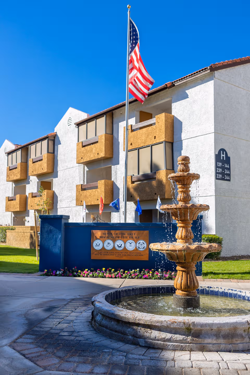 Exterior view of Fellowship Square Historic Mesa with fountain and flagpole