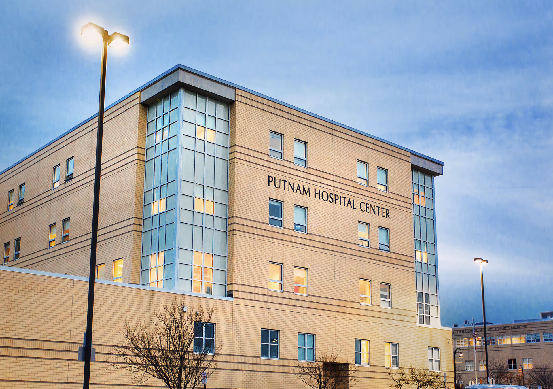 Exterior view of a multi-story hospital building with Putnam Hospital Center signage.