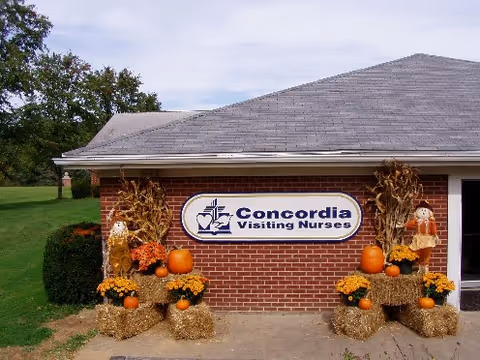 Exterior view of Concordia Visiting Nurses building with pumpkins and autumn decorations