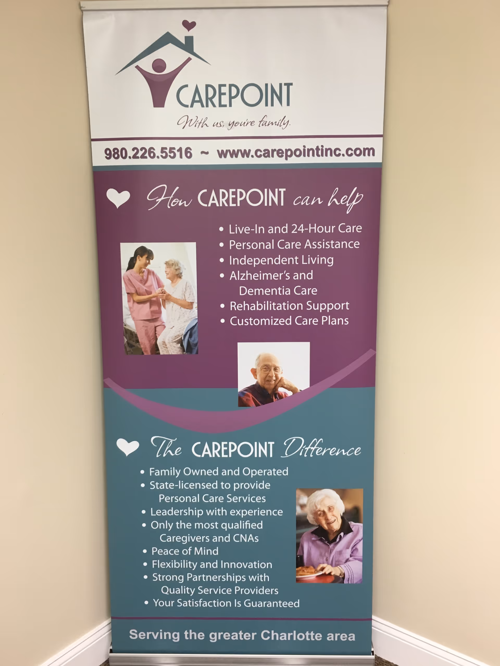 Vertical Carepoint banner with contact information and caregiving services displayed on a wall.