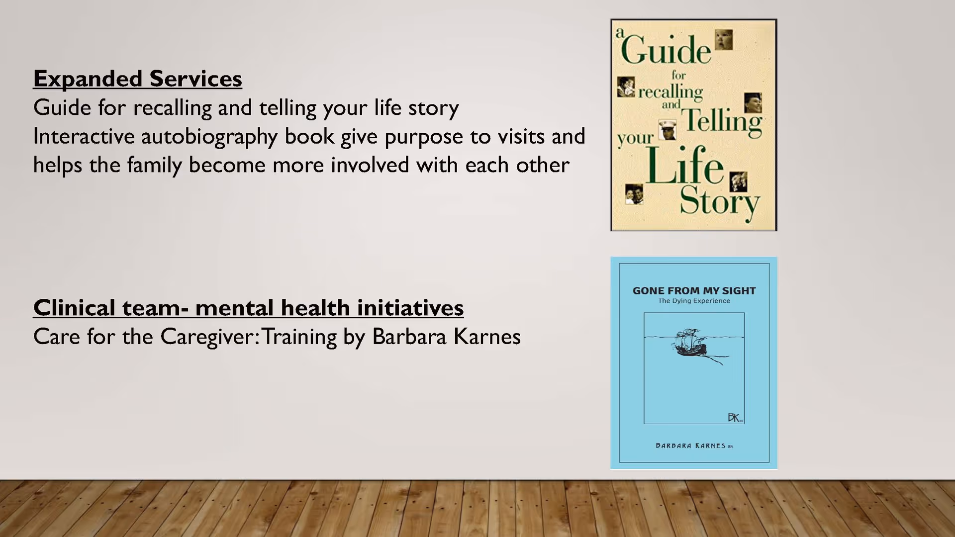 Beige wall with two posters about life stories and caregiving, above a wooden floor.