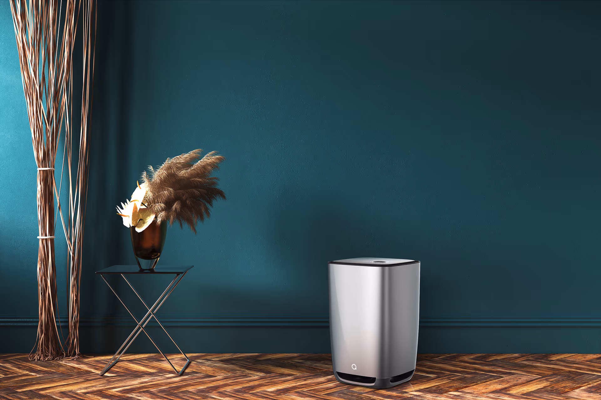 A sleek silver appliance sits on a wooden floor beside a small table and decorative vase.