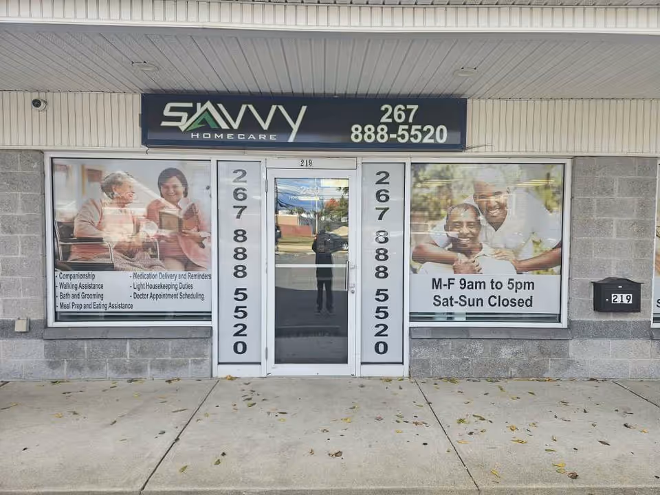 Savvy Home Care storefront with large signs and postered window graphics.