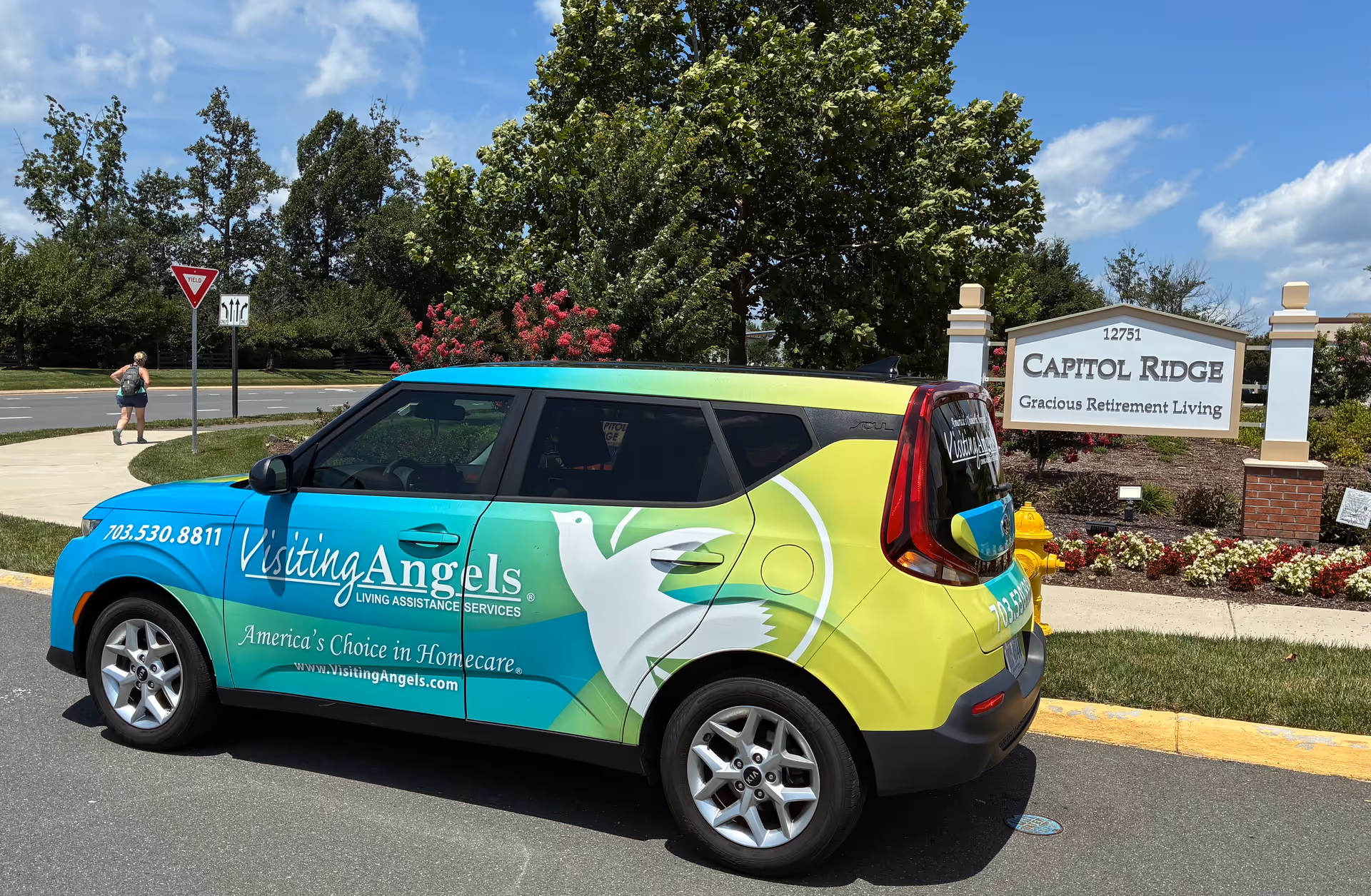 Colorful Visiting Angels van parked outside Capitol Ridge retirement community.