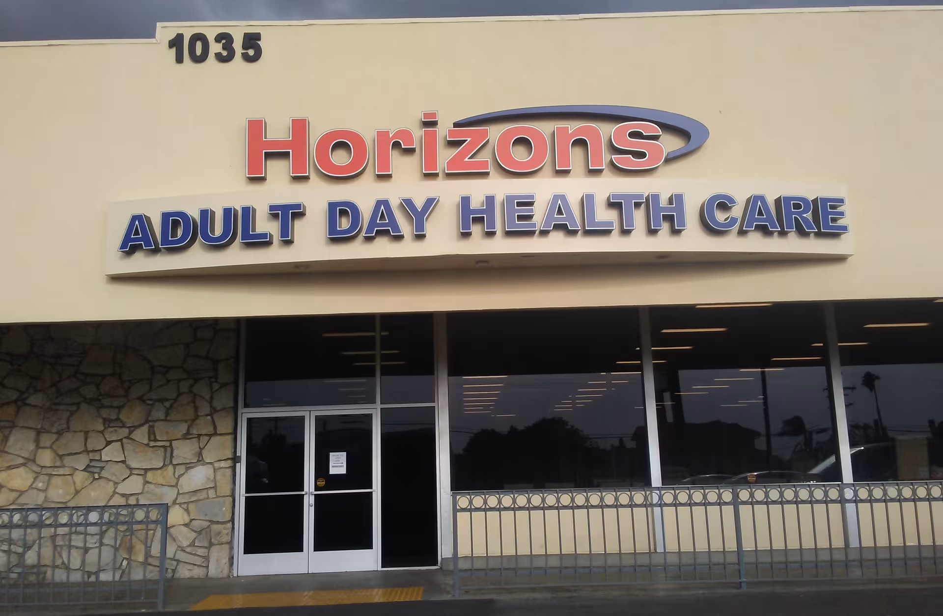 Exterior view of Horizons Adult Day Health Care entrance with large sign.