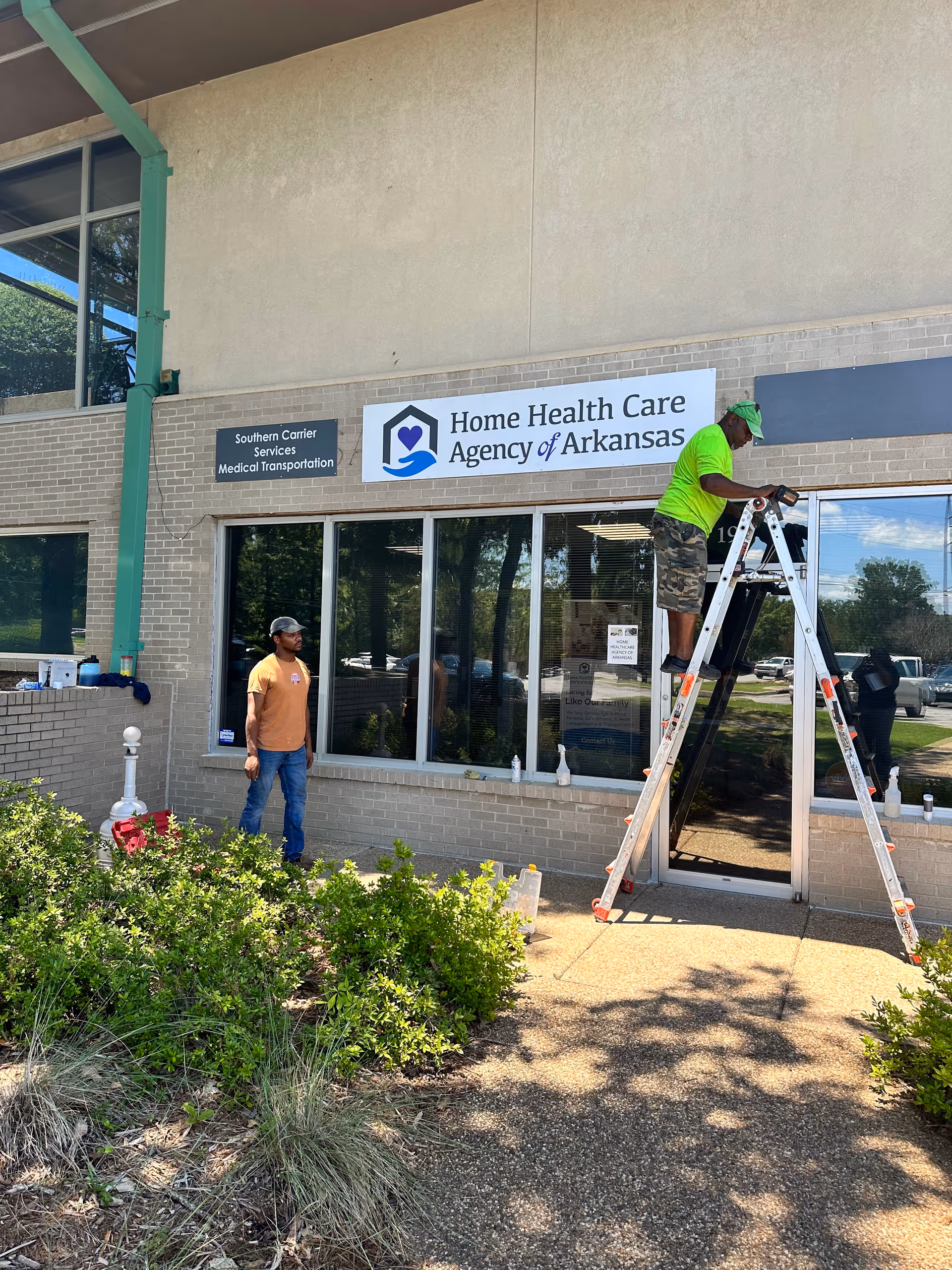 Exterior view of facility entrance with Home Health Care Agency of Arkansas sign.