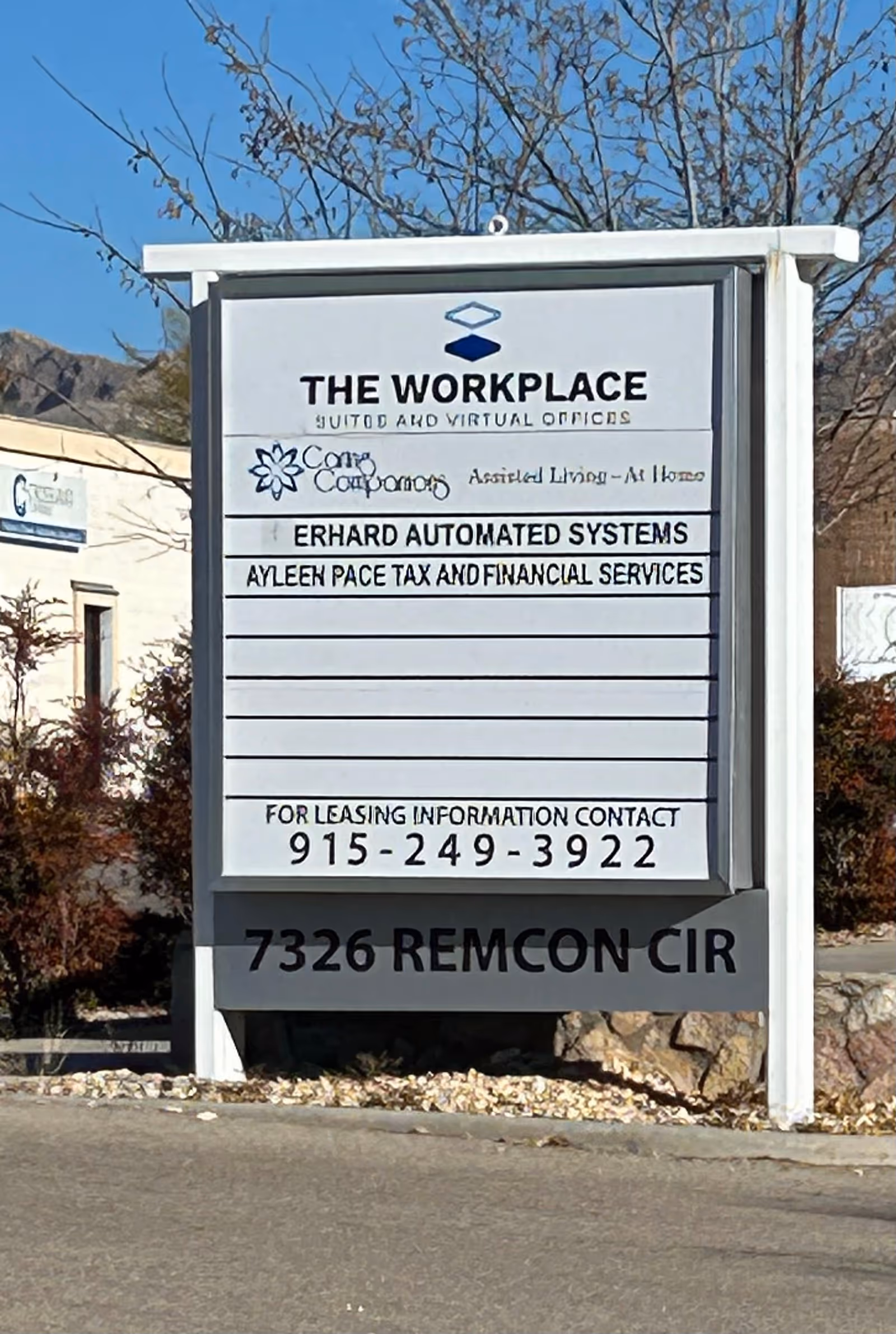 Outdoor signboard for Caring Companions senior facility with additional business listings