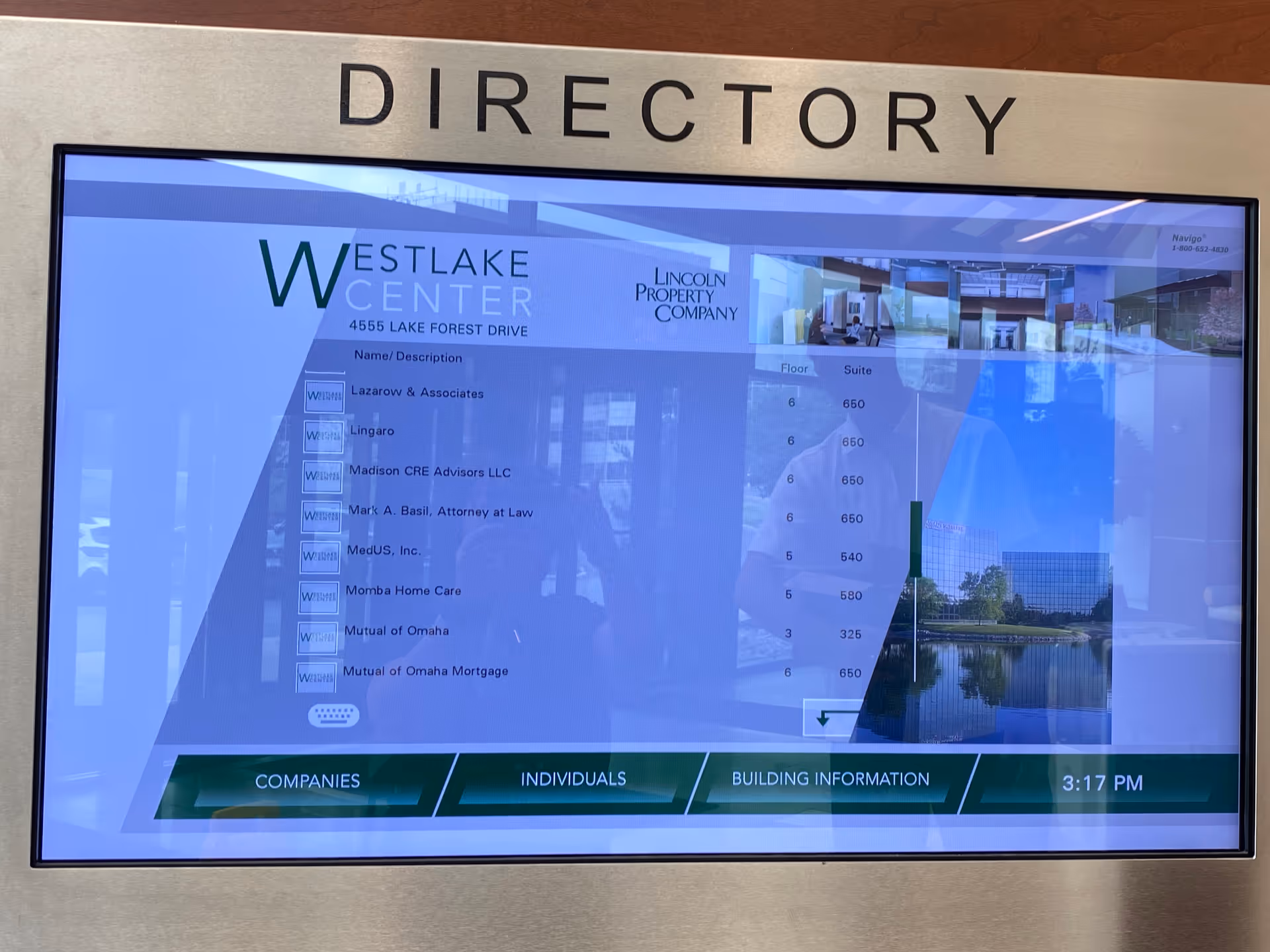 Interior hallway directory screen showing company names and floor information